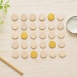 30個の木のコマのうち4個だけが金色になった俯瞰写真。成績5がクラスで4人前後という目安を表している